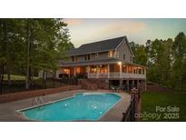 Two-story house with a spacious backyard and inground pool at 176 Butch Branch Rd, Union Grove, NC 28689