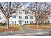 Two-story building exterior with blue shutters and a walkway at 3809 Carl Parmer Dr, Harrisburg, NC 28075