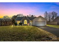 Charming ranch home with stone accents and a spacious yard at 4702 Powder Horne Ln, Conover, NC 28613