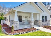 Charming front porch featuring stone accents and a light-colored door at 502 Rhyne Cir, Gastonia, NC 28054