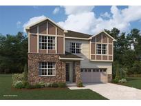 Two-story home with stone accents and a two-car garage at 1443 Honey Trl, Monroe, NC 28112