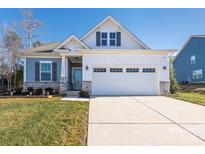 Two-story craftsman style home with a two-car garage and landscaped lawn at 15298 Windward Ln, Lancaster, SC 29720