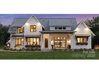 Charming two-story home featuring a welcoming front porch, lush lawn, and beautiful architectural details at 6515 Rehobeth Rd # 2, Waxhaw, NC 28173