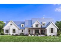 Charming two-story home showcasing a modern farmhouse aesthetic with a manicured lawn and inviting front porch at 6515 Rehobeth Rd # 2, Waxhaw, NC 28173