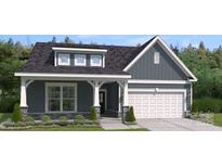 Craftsman style home with gray siding, white trim, and a two-car garage at 4018 Grace Pointe Dr, Indian Trail, NC 28079