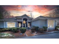 Ranch style home with stone accents and a three-car garage at 104 Cramer Mountain Woods None, Cramerton, NC 28032