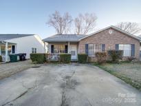 Brick front house with small porch and driveway at 1068 Cherry Meadow Ln, Rock Hill, SC 29732