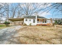 White house exterior with carport and small deck at 3113 Concord Hwy, Monroe, NC 28110