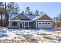 Newly constructed home with a two-car garage and a light green exterior at 1487 Marshbrooke Ln, Catawba, NC 28609