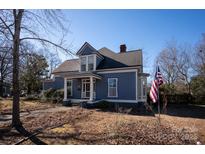 Charming two-story home with a wrap-around porch at 302 S College St, Monroe, NC 28112