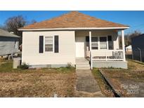 One-story house featuring a front porch, and a small yard at 122 Quinn Ave, Gastonia, NC 28054