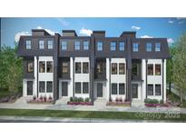 Modern townhomes with a mix of white brick and dark gray siding, complemented by landscaping at 2530 Park Rose Ln # 12, Charlotte, NC 28204