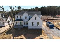 New construction with a light blue front door and white siding, awaiting final touches in a wooded neighborhood at 4257 Candlewood Dr # 7, Sherrills Ford, NC 28673