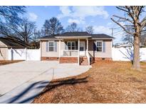 Cute ranch home with front porch, driveway and fenced yard at 700 Leonard Ave, Kannapolis, NC 28081