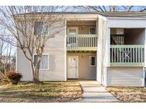 Two-story condo building with light beige siding and private balconies at 1580 Eagles Pl, Rock Hill, SC 29732