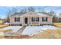 Newly constructed house with light purple siding, black shutters and a covered porch at 3321 15Th Sw Ave, Hickory, NC 28602
