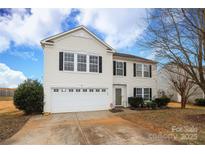 Two-story house with white siding, attached garage, and landscaping at 185 Altondale Dr, Statesville, NC 28625