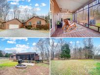 Exterior view of home with garage and screened in porch at 8115 Kingsland Dr, Waxhaw, NC 28173