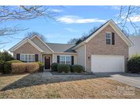 Brick ranch home with a 2-car garage and well-manicured lawn at 109 Washburn Range Dr, Mooresville, NC 28115