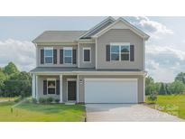 Two-story house with gray siding, a white garage door, and a landscaped lawn at 2238 Catawba Trace Dr, Catawba, NC 28609