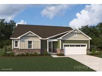 One-story home with green and beige siding, stone accents, and a two-car garage at 2526 Crimson Way, Monroe, NC 28112