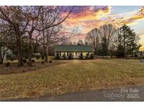 Charming house with well-manicured lawn and sunset view at 2590 Pierson St, Newton, NC 28658