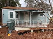 Cute ranch home with light blue siding and a covered porch at 415 Sherman St, Gastonia, NC 28052