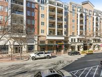 Modern condo building with street-level retail and parking at 4620 Piedmont Row Dr # 608, Charlotte, NC 28210