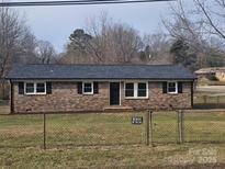 Brick ranch house with a large yard and updated exterior at 4804 Chapel Grove Rd, Gastonia, NC 28052