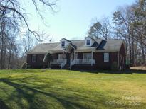 Brick ranch house with a large front yard and mature trees at 4819 Vander Ln # 54, Monroe, NC 28110