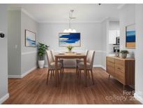 Inviting dining area with a wooden table, seating for four and stylish decor at 5617 Fairview Rd # 9, Charlotte, NC 28209