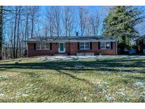 Brick ranch house with a spacious lawn and mature trees at 940 Valley Dr, Newton, NC 28658