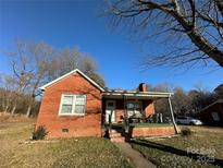 Brick ranch house with front porch at 114 Barker Rd, Dallas, NC 28034