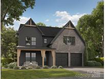 Striking two-story home showcasing a blend of grey brick and siding, accentuated by natural wood beams and a covered porch at 3041 Kinger Ln, Matthews, NC 28105