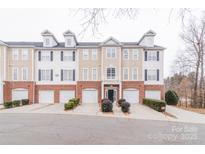 Three-story townhome with attached garage and landscaping at 6416 Park Pond Dr, Charlotte, NC 28262