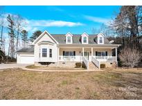 Charming home with a welcoming front porch and well-maintained lawn at 7918 Ridgeview Dr, Sherrills Ford, NC 28673
