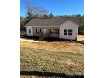 Charming one-story home featuring neutral siding, white trim, and well-maintained landscaping at 819 Wellwood Ave, Statesville, NC 28677