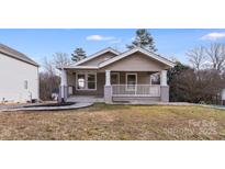 Charming bungalow with a front porch and well-manicured lawn at 508 Beacon St, Gastonia, NC 28054