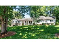 Charming ranch home with a covered porch and manicured lawn at 842 North Center St, Hickory, NC 28601