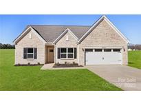 Brick house with 2-car garage and landscaped lawn at 3524 Cloninger Rd, Dallas, NC 28034