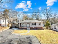 Ranch style home with brick facade and landscaped yard at 404 Ford St, Kannapolis, NC 28083