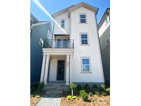 Charming two-story home with a covered porch and fresh landscaping at 425 Delburg Mill Alley Dr, Davidson, NC 28036