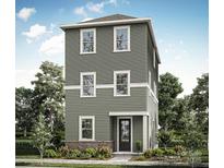 Three-story home with gray siding, white trim, and a brick base at 429 Delburg Mill Alley Dr, Davidson, NC 28036