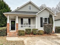 Charming craftsman style home with brick accents and a welcoming front porch at 173 Brookshire Dr, Fort Mill, SC 29715