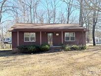 Ranch style home with covered porch and mature trees at 1993 Powell Ave, Lancaster, SC 29720