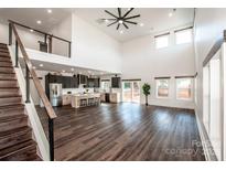 Open concept living area with kitchen, loft, and hardwood floors at 219 Mock Mill Rd, Statesville, NC 28677