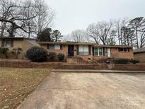 Brick ranch home with a spacious yard and parking at 4818 Highlake Dr, Charlotte, NC 28215