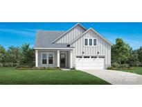 One-story house with gray siding, white trim, and a two-car garage at 5213 Mint Harbor Way # 0351, Charlotte, NC 28269