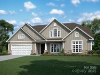 Two-story house with neutral siding, a three-car garage, and landscaping at 13111 Gambelii Way # Oak0030, Mint Hill, NC 28227