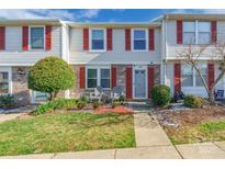 Brick townhouse with red shutters, front porch, and landscaping at 182 Water Oak Dr, Pineville, NC 28134